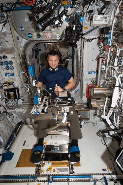 astronaut andrew morgan working inside the space station